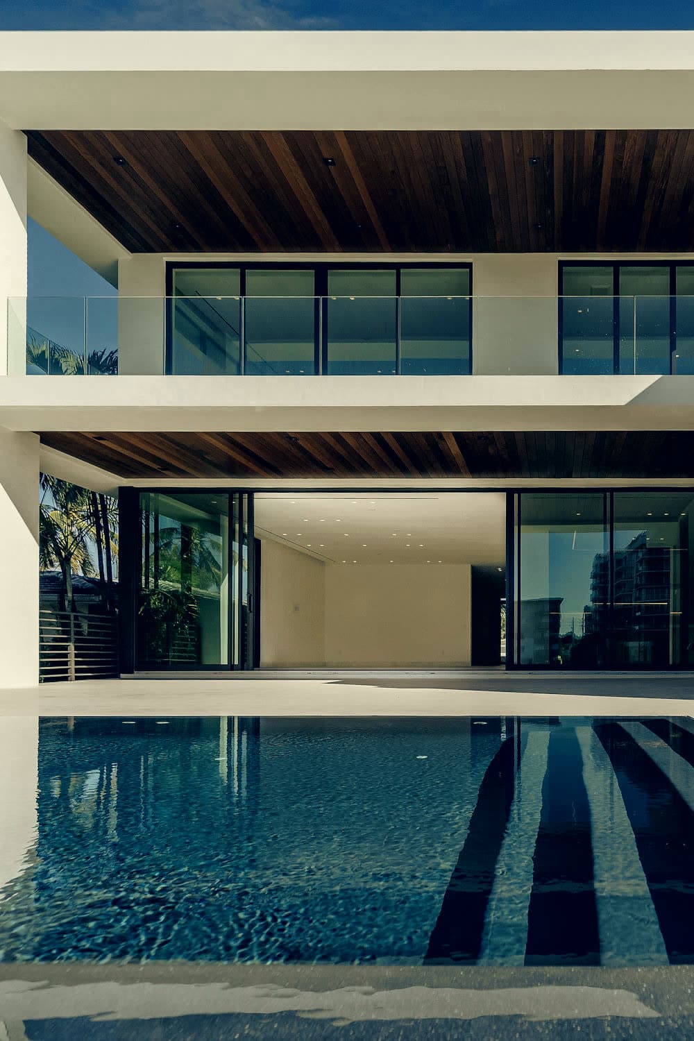 Timber-lined terraces over a lap pool